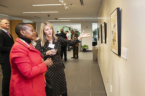 Rebecca Schutt, former head of the British Council’s DICE program, discusses the artwork on display at Mason Square with Elsie S. Kanza, ambassador of the United Republic of Tanzania to the U.S. and Mexico. Photos by Ron Aira/Creative Services
