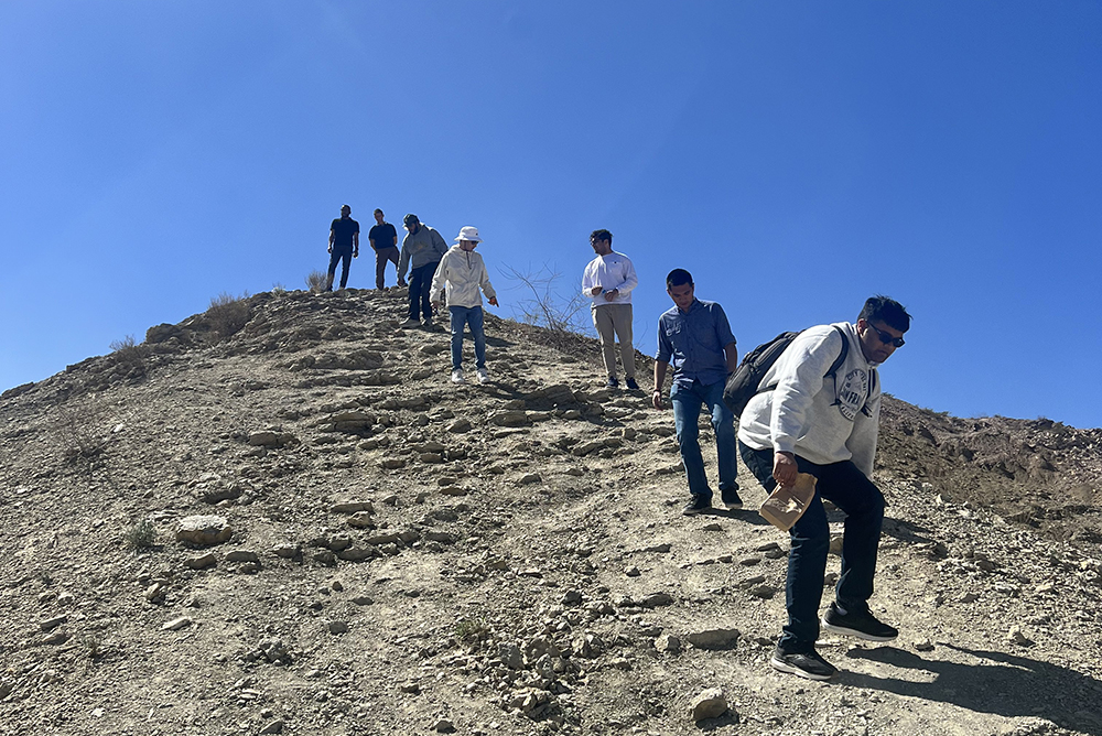 IR Policy Task Force students climbing a hill.