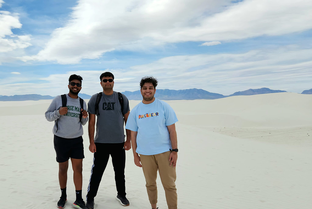 Three IR Policy Task Force students pose for a photo on white sand dunes while on the spring break study abroad trip to Ciudad Juárez and El Paso.
