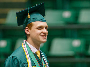 Photo of a Schar School graduate